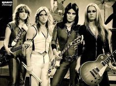 the runaways posing with their guitars