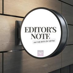 a sign that says editor's note on the side of a wall next to a door