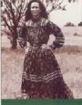 an old photo of a woman in a dress