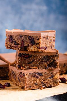 chocolate and cranberry bars stacked on top of each other