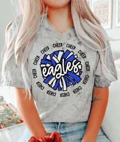 Introducing the Eagles Cheer DTF Transfer, perfect for any fan looking for a unique and high-quality design for their t-shirt! Rely on Rustic Grace, the #1 online store for heat transfer designs and vinyl transfers, to deliver a product that will exceed your expectations. Our DTF transfer process ensures that the full-color design is vibrant and long-lasting, without cracking or fading over time. Made with only the highest quality materials, these transfers are guaranteed to look great on any t- Middle School Cheer Shirts, Blue School Spirit T-shirt With Sublimation Print, Blue T-shirt With Sublimation Print For School Spirit, Blue School Spirit Sublimation T-shirt With Graphic Print, Blue Graphic Print Sublimation Design For School Spirit, Blue Sublimation Design Shirt With Graphic Print For Fans, Blue Graphic Print Sublimation Design For Fan Gear, Blue Graphic Print Sublimation Fan Gear, Blue Crew Neck Tops With Glitter Print