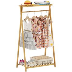 PRICES MAY VARY. 【Minimalist Design】This kids clothes rack features a sleek, modern-minimalist design. It seamlessly blends practical storage functionality with a clean, uncluttered aesthetic. While it efficiently stores your kids' clothes, it also serves as a stylish piece of furniture, adding a touch of elegance to any room. The natural, fresh-toned finish complements every home decor style, whether it's a contemporary living room or a cozy kids' bedroom. It won't just a garment rack; it will Nursery Clothes Storage, Toddler Dress Up Station, Dress Up Clothes Storage, Bamboo Clothes Rack, Dress Up Rack, Dress Up Corner, Dress Up Area, Kids Clothes Storage, Dress Up Stations