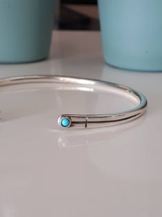 Turquoise Silver Bracelet, Simple Cuff Bracelet, Bracelet for Women, Silver cuff Bracelet, Summer Bracelet, Tiny Silver Bracelet Unisex handmade solid silver cuff bracelet, great for wearing everyday. It is formed into an oval to fit the wrist comfortably and the ends are gently rounded to enable you to put it on and take it off with ease. Although made from thick silver there is a certain amount of give in the bangle allowing you to adjust it by carefully squeezing the ends together or pulling Simple Silver Bracelet, Turquoise Silver Bracelet, Bracelet Summer, Summer Bracelet, Bracelet Minimalist, Bracelet Simple, Turquoise Bracelet Cuff, Summer Bracelets, Bracelet Gemstone