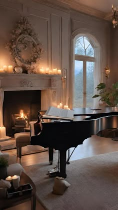 a living room with a grand piano and candles