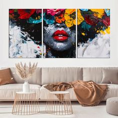 two paintings on the wall in a living room