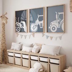 a set of three pictures hanging on the wall above a bench with storage bins