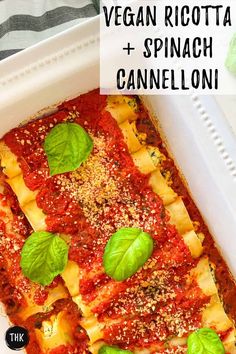 vegan ricotta and spinach cannelloni in a white casserole dish