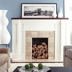 a living room filled with furniture and a fire place in front of a painting on the wall