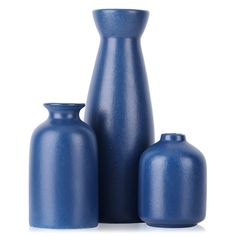 three blue vases sitting next to each other