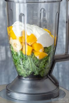 a blender filled with lots of different types of food on top of a table