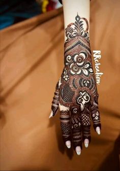 a henna tattoo on someone's hand