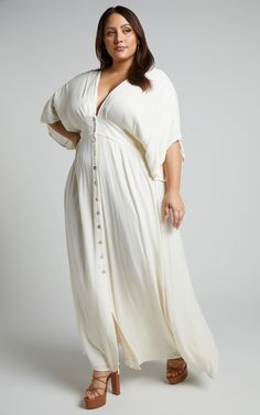 Sitting Pretty Maxi Dress In Natural | Showpo USA V-neck Maxi Dress With Button Closure For Daywear, Flowy V-neck Maxi Dress With Buttons, V-neck Maxi Dress With Buttons For Date Night, V-neck Maxi Dress With Buttons For Daywear, White Maxi Dress With Buttons, Chic Buttoned Maxi Dress For Vacation, Flowy Maxi Dress With Buttons For Brunch, Chic Maxi Dress With Buttons For Vacation, Casual V-neck Rayon Maxi Dress