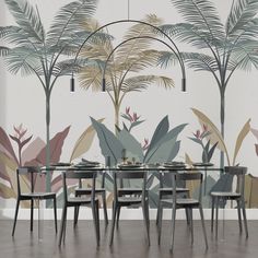 a dining room table with chairs and a wall mural behind it that has palm trees on it