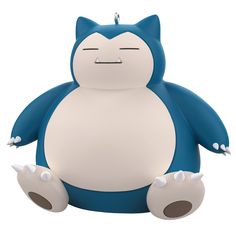 a blue and white cat ornament sitting on top of it's legs