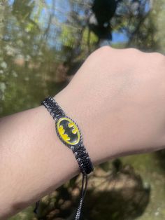 Set a fun tone for your relationship with these handmade Batman matching couples’ bracelets! Crafted with care, these accessories are perfect for couples who share a love for the Caped Crusader! Show your commitment to each other and your fandom with these unique Batman Neon Friendship Bracelets! #dynamicduo ☆ We work as quickly as possible to create your bracelets. However, since each order is handmade to order it can take 7-10 business days for your order to be shipped. (This does not include Adjustable Novelty Wristband, Customized Novelty Bracelets, Adjustable Novelty Jewelry For Friendship, Novelty Customized Adjustable Bracelet, Black Fandom Jewelry Gift, Black Fandom Inspired Jewelry Gift, Fandom Style Black Jewelry Gift, Fandom Style Personalized Jewelry Gift, Handmade Adjustable Themed Charm Bracelet