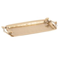 a gold tray with handles and flowers on it