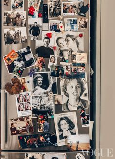 a refrigerator covered in pictures and magnets