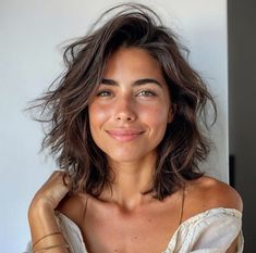 Not everyone who wants a low-maintenance haircut wants to completely chop off their tresses. So what’s a gal to do? Medium Short Haircut With Layers, Collarbone Layered Hair, Shoulder Length Messy Hair, Tousled Bob Medium Length, Short Brunette Wavy Hair, Undone Bob Haircuts, Brunette Shoulder Length Hair Layers, Layered Collarbone Length Hair, Short Haircut Women Layers