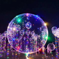 various images of bubbles floating in the air with colored lights on top and below them