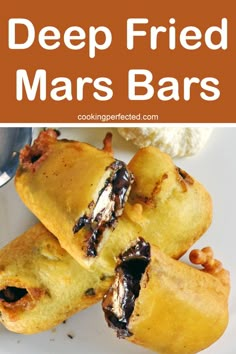 deep fried mars bars on a white plate with text overlay that reads deep fried mars bars