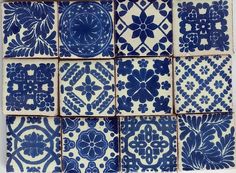 blue and white tiles are arranged in rows