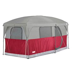 a red and gray tent is shown with the sidewalls closed up to show the inside