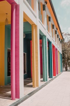 colorful columns line the side of a multi - colored building