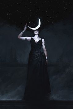 a woman in a long black dress with a crescent moon on her head, standing at night