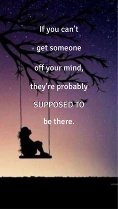 a person sitting on a swing with the words if you can't get someone off your mind, they're probably supposed to be there