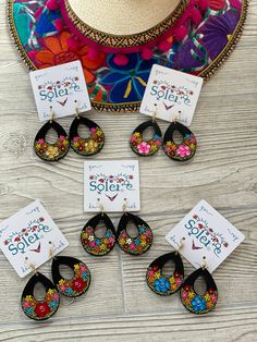 These beautiful earrings are hand painted on wood. It is the perfect accessory and pop of color for your outfit! Every piece is completely unique because of the detailed process that goes into creating it. The black lacquer is created by mixing in layers of dirt with a grease from the Cochinilla bug. The flowers are painted on with our finger tips using ground up natural pigments and linseed oil. To finish the process we apply a protective coat to conserve the painting and give it a shiny look. Diy Crafts Earrings, Mandala Jewelry, Mexican Earrings, Leather Jewels, Natural Pigments, Hand Painted Earrings, Mexican Jewelry, Finger Tips