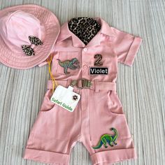 a pink outfit and hat for a baby girl