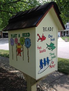 a mailbox that has been painted to look like the dr seuss book house