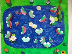 an art project with paper flowers and fish in the water on a bulletin board for kids to make