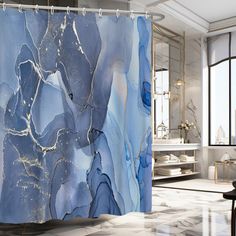 a shower curtain with blue marble on it in a white and black bathroom, next to a large window