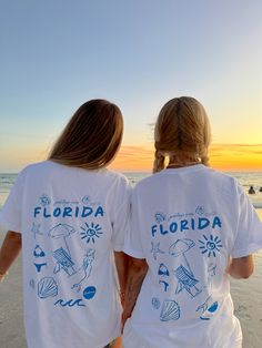 Our EXCLUSIVE Greetings From Florida Sunhoney T-shirt is perfect for beach lovers! This Comfort Colors t-shirt features a playful blue drawn design of popular Florida symbols like the sun, shell, mermaid, and more. Style this shirt over your fave bikini as your new go-to beach tee or style with biker shorts and sneaker Florida Symbols, Shell Mermaid, Cute Summer Fits, Jacksonville Beach, Beach Tee, Preppy Style Summer, Affordable Fashion Women, Style Inspiration Fall, Beach Lovers