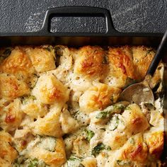 a casserole dish with chicken and spinach in it is ready to be eaten