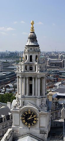 an aerial view of a clock tower in the city