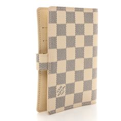 This is an authentic LOUIS VUITTON Damier Azur Small Ring Agenda Cover. This stylish agenda is finely crafted of blue and ivory Louis Vuitton signature checkerboard coated canvas. The agenda has a crossover strap that unsnaps to an ivory cross-grain leather interior with card slots, patch pockets, pen loop, gold rings for inserts, and a Louis Vuitton ruler insert. Agenda Cover, Small Ring, Louis Vuitton Damier Azur, Small Rings, Leather Interior, Authentic Louis Vuitton, Louis Vuitton Damier, Ruler, Crossover