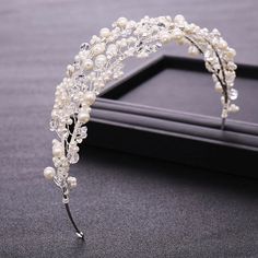 The Pearl And Crystal Branch Headband Is An Irresistible Bridal Headband Made From Two Pearl And Crystal Branches. This Is A Great Bridal Accessories For Brides That Prefer A Headband To A Tiara. It Pairs Well With Pearl Accessories And Other Silver Jewelry And Can Also Be Worn For Other Events Like Baby Showers, Bridal Showers And Photo Shoots. Length: 16 Inches. Width: 2 Inches. #Headband #Bridalheadband #Hairjewelry #Bridalaccessories #Weddingaccessories Bridal Headband With Veil, Pearl Wedding Headband, Headband With Veil, Bridal Crown Tiara, Pearl Bridal Headpiece, Pearl Bridal Headband, Wedding Hair Head Piece, Wedding Hair Headband, Crystal Bridal Tiaras