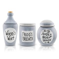 three jars with words on them sitting next to each other in front of a white background