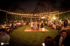 a couple dancing on the dance floor at their wedding reception