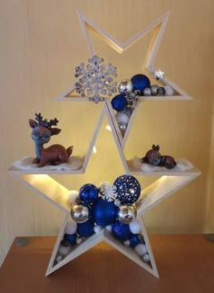 a star shaped shelf with ornaments on it