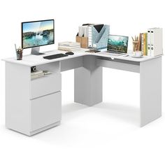 a computer desk with a monitor and keyboard on it