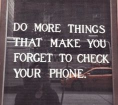 a sign that says do more things that make you forget to check your phone