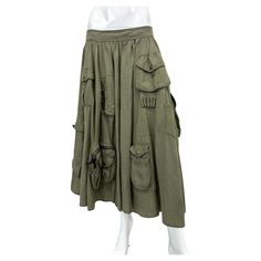 S/S 2003 Dolce & Gabbana midi skirt with big cargo pockets. Military inspired design. Composition: linen, made in Italy Conditions: great, no significant flaws Size: missing size tag Waist: 40cm / 15,7inches Total length: 75cm / 29,5inches Summer Cotton Skirt With Multiple Pockets, Summer Tiered Cargo Skirt With Pockets, Tiered Cargo Skirt With Pockets For Summer, Khaki Knee-length Skirt With Pockets, Green Utility Cargo Skirt With Pockets, Green Tiered Skirt With Pockets, Khaki Cotton Cargo Skirt With Multiple Pockets, Utility Skirt With Pockets In Khaki, Knee-length Utility Cargo Skirt With Pockets