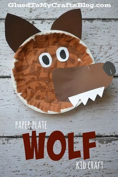 a paper plate shaped like a dog's head with large eyes and brown hair