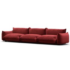 a red couch sitting on top of a white floor