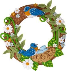 a wreath with two blue birds sitting on it's side and daisies around the edge