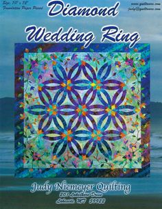 the diamond wedding ring quilt pattern is featured in this book, featuring an image of a flower