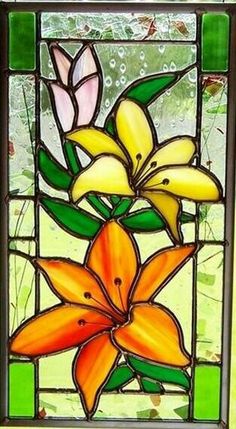 a stained glass window with flowers on it